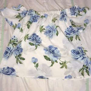 White blouse with baby blue roses.